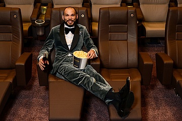 CLOTHES MAKE PEOPLE: With popcorn and tuxedos in the front row